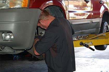 Mechanic working on a vehicle at C & D Auto Care